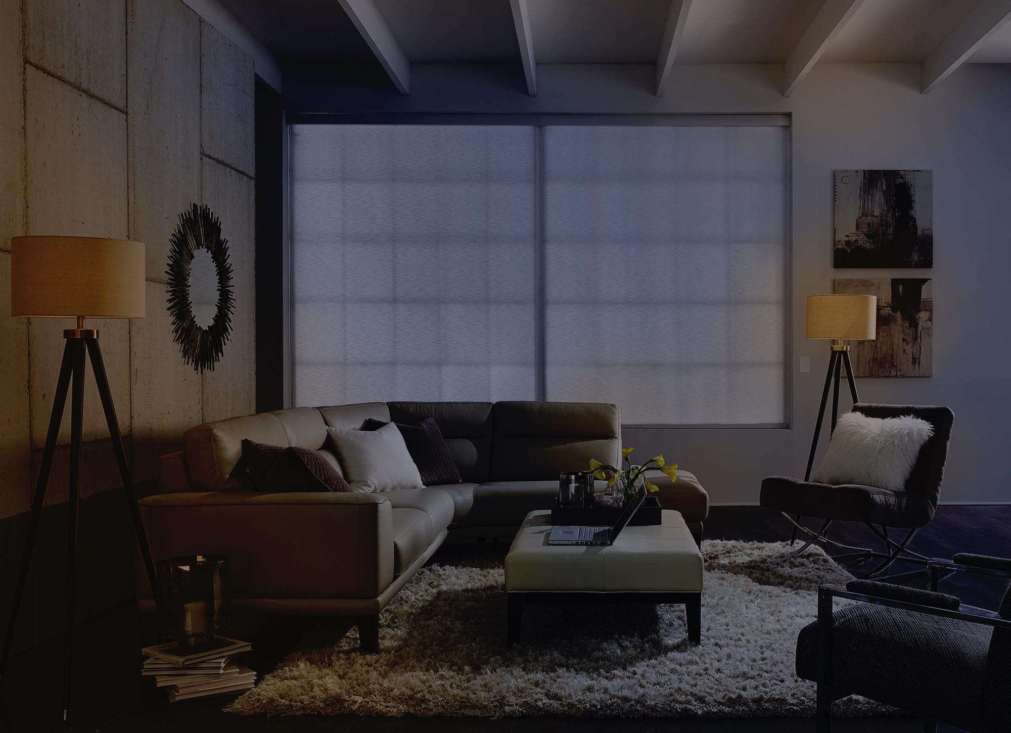 Bedroom lit with a warm Lutron scene